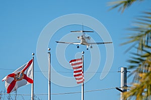 Private Jet flying over US and Florida Flags