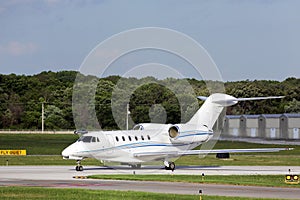 Private jet taxiing for departure photo