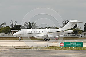 Private jet taxiing on the ground photo