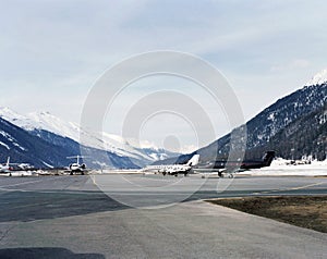 Private jets in the snow covered landscape of St Moritz Switzerland