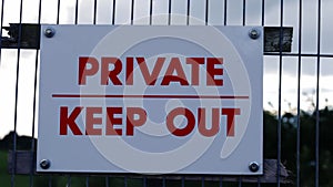 Private keep out sign on fence zoom