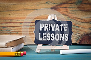 Private Lessons, education concept. small wooden board with chalk on the table