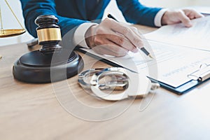 The private office workplace for consultant an young lawyer legislation with gavel and document on wood table