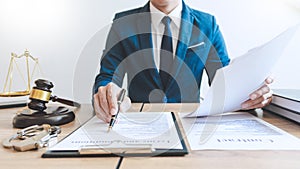 The private office workplace for consultant an young lawyer legislation with gavel and document on wood table