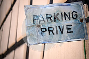 private parking panel in french parking prive, traduction in english : private parking in the street photo
