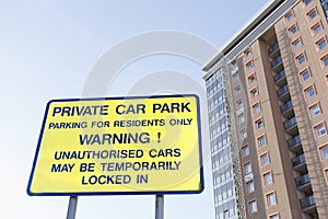Private parking residents only sign and flats tower block