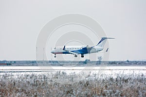 Private plane landing at the winter airport