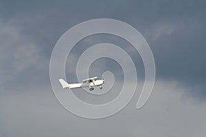 Private plane on a strormy sky
