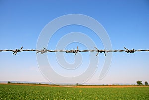 Private property fenced with barbed wire