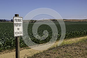 Private Property no trespassing sign on farm land