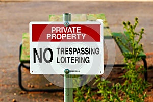 Private property no trespassing sign on a post