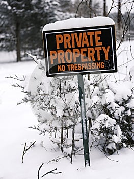 Private Property No Trespassing Sign in the Wooded Meadow