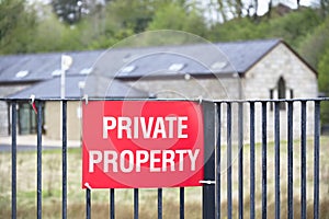 Private property red sign on entrance gate