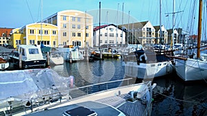 Private sailboats and yachts docked in Nyhavn harbor, Copenhagen city port