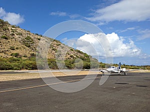 Private small plane landing on the island