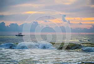 Private sport fishing boat just off the Florida coast at sunrise.