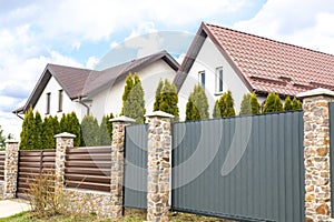 Private suburban house with back yard behind high fence. beautiful landscape recreation cottage complex in ecological area with