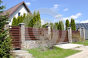 private suburban house with backyard behind high fence. beautiful landscape recreation cottage complex in ecological