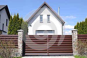 private suburban house with backyard behind high fence. beautiful landscape recreation cottage complex in ecological