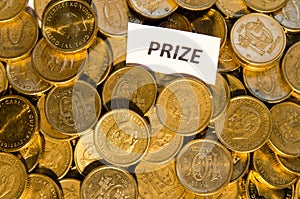 Prize sign at a stack of golden coins