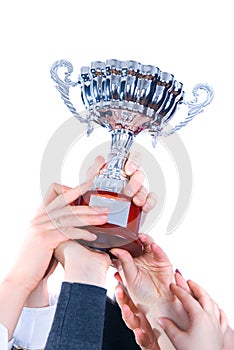 Prize-winning cup in hands of a command