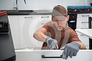 Pro Cabinetmaker Installing New Kitchen Furnitures