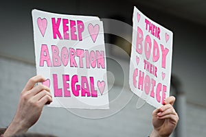 Pro choice Planned Parenthood demonstration holding two signs photo
