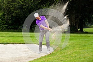 Pro golfer bunker shot photo