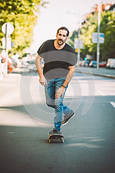 Pro skateboarder ride skateboard on capital road street through