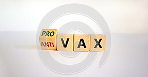 Pro-vax or anti-vax symbol. Turned a cube  changed words \'anti-vax\' to \'pro-vax\'. photo