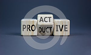 Proactive and productive symbol. Turned cubes and changed the word `productive` to `proactive`. Beautiful grey background, cop