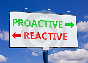 Proactive and reactive symbol. Concept word Proactive Reactive on beautiful billboard with two arrows. Beautiful blue sky with
