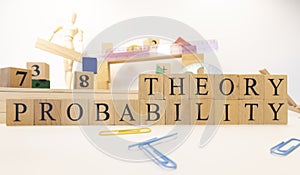 Probability theory was created from wooden cubes. Education concept.