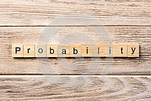 Probability word written on wood block. probability text on table, concept