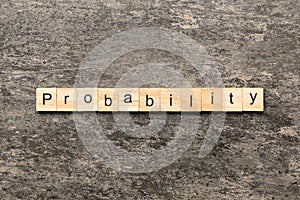 probability word written on wood block. probability text on table, concept