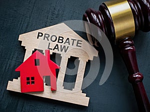 Probate law concept. Gavel and house model.