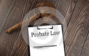 PROBATE LAW text on paper with gavel on wooden background