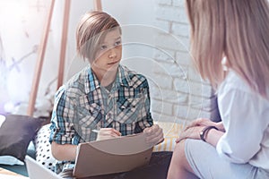 Problem boy attending professional psychotherapist