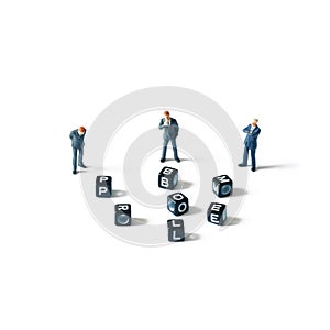 Problem in business world concept: Three businessman figurine looking at scattered cubes with problem word on white background