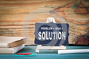 Problem, Idea, Solution. education concept. small wooden board with chalk on the table