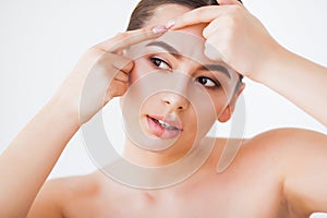 Problem Skin. Woman Crushing Spot On Face And Looking In Mirror