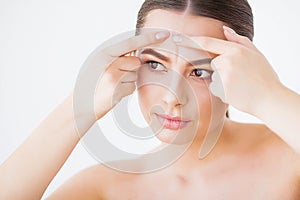 Problem Skin. Woman Crushing Spot On Face And Looking In Mirror