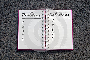 Problem and Solution, Business Concept. Problems and solutions list in white notebook