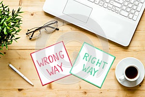 Problem solving. Right and wrong way icons on work desk from above