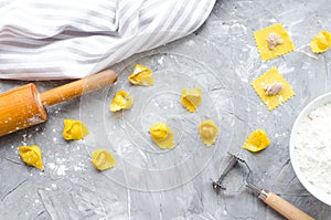 Proccess of making traditional Italian tortellini photo