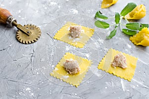 Proccess of making traditional Italian tortellini photo