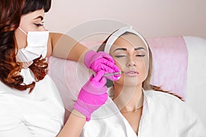 Procedure filler injection in beauty clinic.