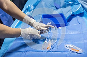 The procedure of inserting a double lumen catheter into a patient with cardiovascular occlusion in the hospital. Doctor insert