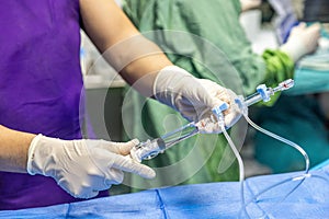 The procedure of inserting a double lumen catheter into a patient with cardiovascular occlusion in the hospital. Doctor insert