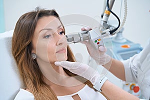 Procedure for laser removal of neoplasms on the face in a cosmetology clinic